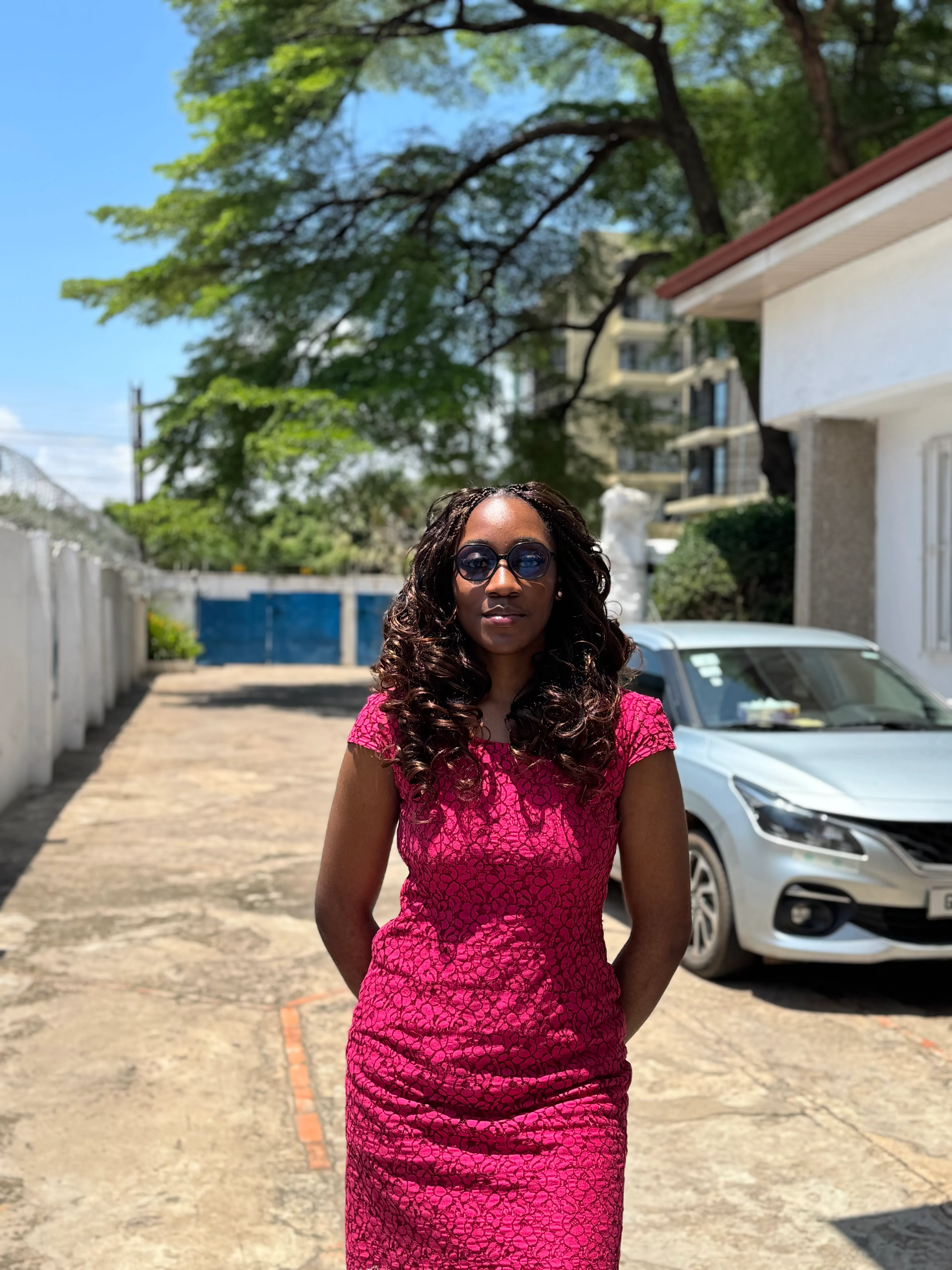 Nkechi Emechukwu in a magenta dress